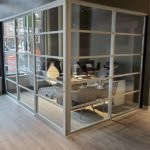 Office with workstation with glass space divider