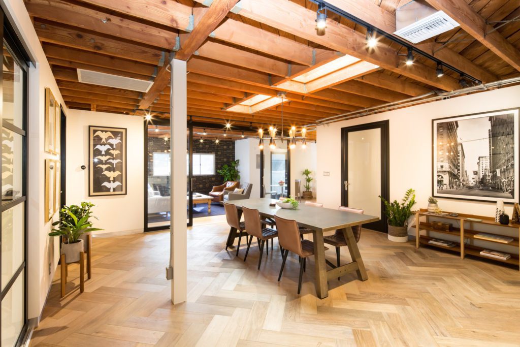 glass sliding door separating a dining and living space